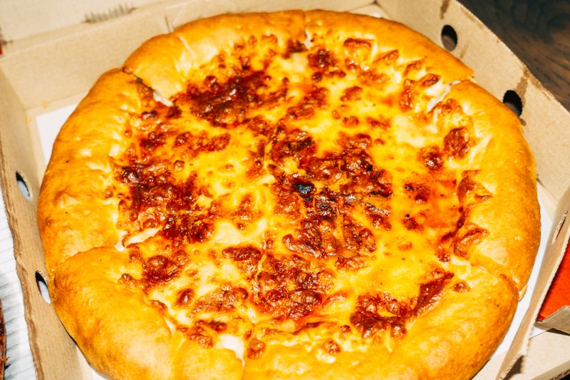 Cheese pizza with four types of cheese melted together
