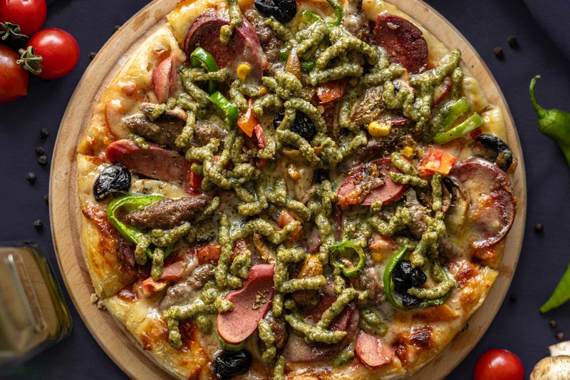 Meat lovers pizza loaded with sausage and ham